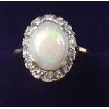 An 18 carat gold opal and diamond cluster ring