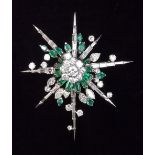 A fine quality 18 carat gold stellar form brooch set baguette, brilliant and marquise cut emeralds