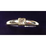 An 18 carat white gold square solitaire diamond ring size N 1/2