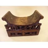 An Indian antique temple stool with carved decoration