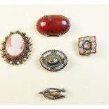 A group of antique brooches including silver