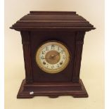 An arch top mahogany mantel clock