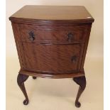 A mid 20th century reproduction bedside cabinet