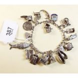 A silver charm bracelet - 53g