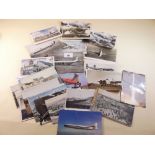 A bundle of postcards including aeroplanes and beach scenes