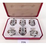 A set of six silver plated frog form knife rests - boxed