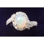 A silver ring set Ethiopian opal - size N