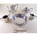 A silver plated coffee pot, milk and sugar and a silver plated floral decorated teapot plus a silver