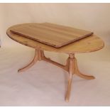 A good quality modern light wood oval kitchen dining table with interleaf