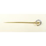 A 9 carat gold stick pin set pearl