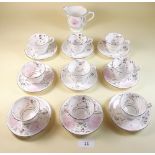 A Victorian part pink lustre tea service comprising eight small cups and saucers and a milk jug