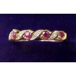 A 9 carat gold ring set rubies and chip diamonds - size S