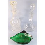A 19th century moulded glass decanter, an Edwardian form bottle decanter and a green glass swan