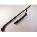A leather cane and a leather cosh