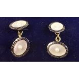 A pair of 18 carat gold cufflinks set mother of pearl