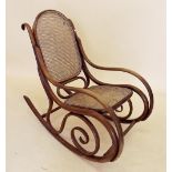 A Victorian bentwood rocking chair with cane seat and back
