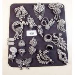 A collection of vintage diamonte brooches and clips