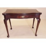 A George III style mahogany serpentine top fold top tea table on cabriole supports - circa 1900