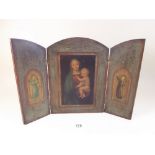 An early 20th century continental triptych print and oil on panel Madonna and Child flanked by