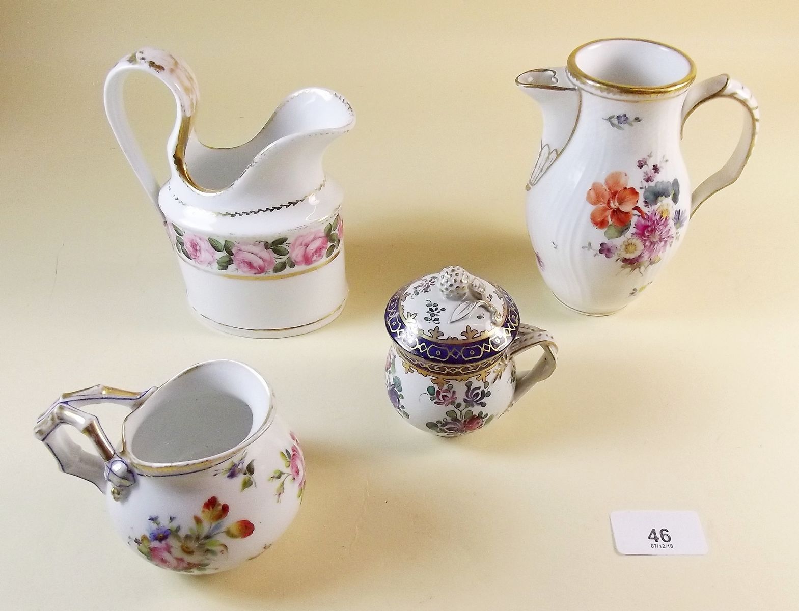 A collection of four 19th century hand painted jugs and pots