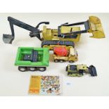 A box of tinplate Tonka toys: No2534 Trencher, No1045 Ruff Rider, No521 Tiny Loader, 575 Cement