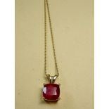 A cushion cut AAA ruby pendant on 9k gold chain