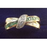 A 9 carat gold emerald and diamond crossover half eternity ring, size O