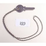 A silver key on chain