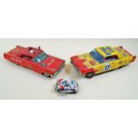 A group of tinplate modern toys including electric stunt car, push and go red Cadillac, clockwork