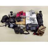 A box of cameras including a Polaroid Swinger II Land camera, a Brownie Box camera in case, a