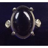 A Dominican blue amber and zircon platinum plated on white gold ring , size O