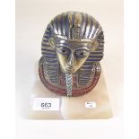 A brass Egyptian mask statue on alabaster base 14cms high