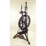 A 19th century turned wood Doughty spinning wheel