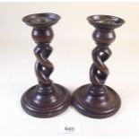 A pair of oak twist stem candlesticks