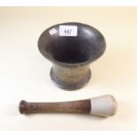 An antique bronze mortar and later pestle