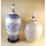 An Oriental style lamp - 38cm and a cream Laura Ashley lamp with raised leaf decoration - 27cm