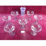 A set of seven Babycham glasses and a retro glass tumbler