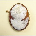 A 9 carat gold mounted cameo brooch with carved portrait of a lady with flowers 4.2 x 3.2cm