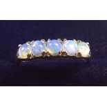 A 14k white gold ring set five opals, size N