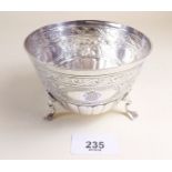 A Victorian silver bowl with engraved and embossed decoration dated June 1880 and monograms - London