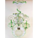 A Victorian green Vaseline glass Epergne with large central flute, three smaller flutes and three
