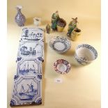 A box of china items including Delft tiles and figures