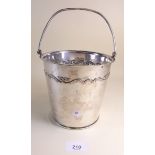 A silver plate on copper ice bucket