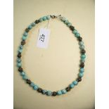 A turquoise and silver necklace