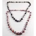 Two banded agate necklaces - one butterscotch - 157g, and one black and white - 116g
