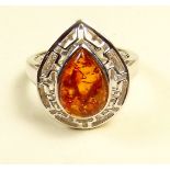 A silver ring set amber