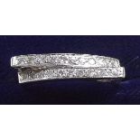 A 9 carat white gold ring off set two rows of diamonds - size M