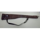 A double gun slip of fine quality leather with fleece lining and block ends