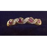 A 9 carat gold ring set rubies and chip diamonds - size S