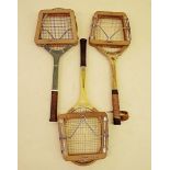 Three old tennis racquets and presses